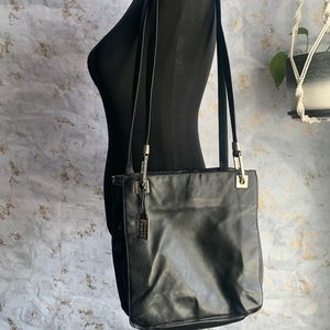 Valerie Stevens Black Leather 3 pocket Shoulder purse with silver hard ware.